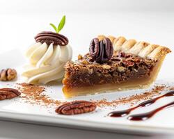 a piece of pie on a plate with whipped cream and a pecan photo