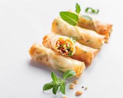 a plate with several spring rolls on it photo