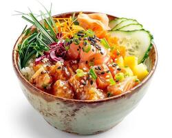 a bowl of food with vegetables and salmon photo