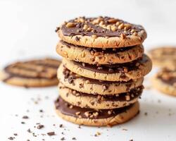 a stack of peanut butter cookies with chocolate frosting photo