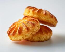 three biscuits on a white surface photo