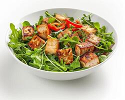 a white bowl with a salad and tofu photo