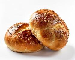 two buns with sesame seeds on a white background photo