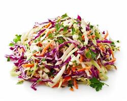 a pile of shredded cabbage and carrots on a white surface photo