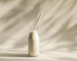 a glass bottle with a straw in it photo