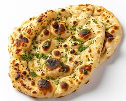 two flatbreads on a white surface photo