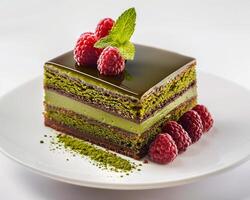 a piece of cake with raspberries on top photo
