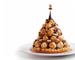 a waffle tower with chocolate and nuts on top photo
