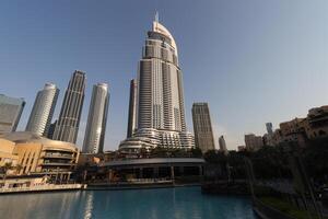uae, dubai , 1th December 2022 a picture of the burj khalifa with towers and buildings in the night with small lake photo