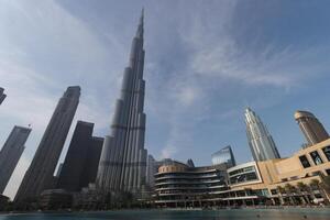 uae, dubai , 1th December 2022 a picture of the burj khalifa with towers and buildings in the night with small lake photo
