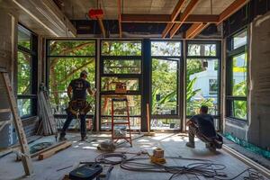 Two men are working on a construction site, one of them is wearing a hard hat photo