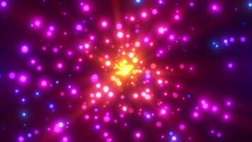 Abstract colorful background with flying bokeh particles. Magical bright dots fly away from the center like bright fireworks. Looping 4K animation. video