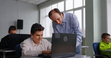 Computer Science Lessons In Middle School, Teacher Helping To Teen Boy Student, Programming Courses video