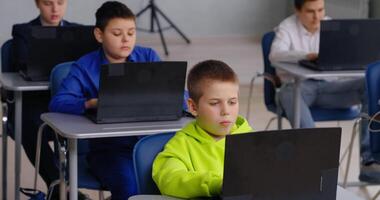 Education In Modern School, Group Of Diverse Teens Boys Programming And Coding In Classroom video