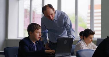 Informatics Lessons In Middle School, Teacher And Pupils In Modern Computer-Based Classroom video