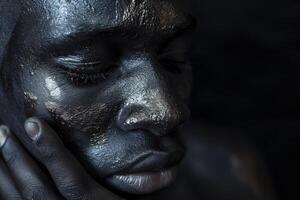 Contemplative portrait with artistic makeup photo