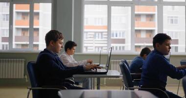 Teens Students Boys Working With Laptops In Computer-Based Classroom In Modern School video