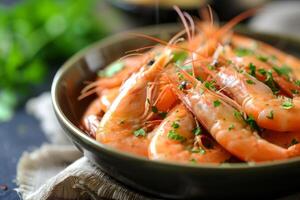 Fresh cooked prawns with herbs in bowl photo