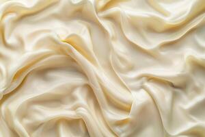 Highquality image of elegant creamcolored silk fabric with smooth waves photo