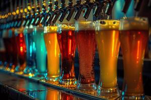 Bartender pouring fresh craft beer from taps in a row at pub photo