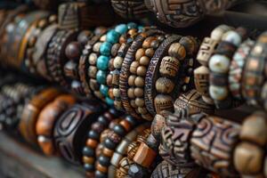 Closeup shot of a colourful collection of handmade beaded bracelets displayed in a row photo
