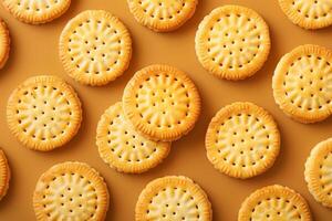Round crispy biscuits lying on yellow background forming pattern photo