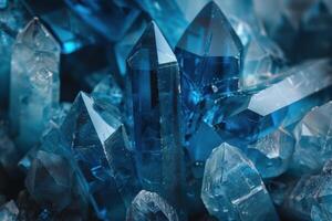 Macro close up of a group of pointing upwards aquamarine crystals photo
