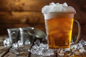 Cold beer overflowing with foam is sitting on a wooden table with ice cubes photo
