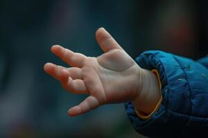 Toddler reaching out hand showing empty palm photo