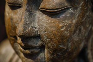 Close-up of ancient weathered stone statue photo