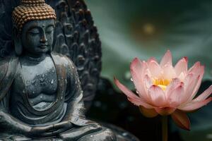 Serene buddha statue with blooming lotus flower photo