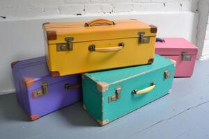 Vintage colorful suitcases on white background photo