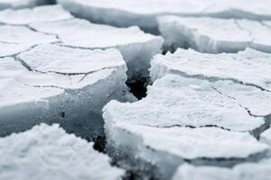 Closeup of a broken ice surface showcasing intricate patterns and frosty textures photo