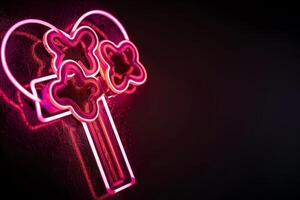 Neon heart keys on dark background photo