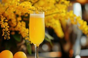 Refreshing mimosa cocktail with spring blooms photo