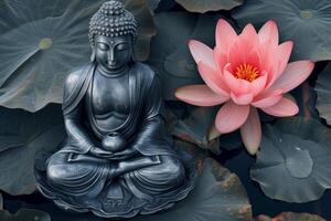 Serene buddha statue with lotus flower photo