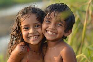 Portrait of a girl and boy hugging with bright smiles in a natural setting photo
