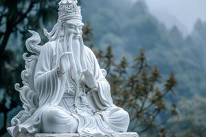 Serene white marble guan yu statue against misty background photo
