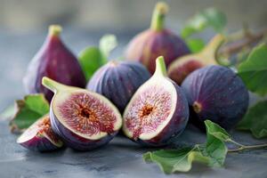 Fresh figs display on textured surface photo