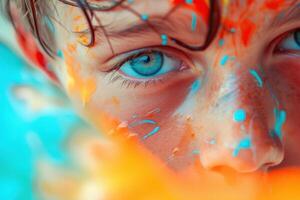Vivid imagination - close-up of child with paint-splattered face photo