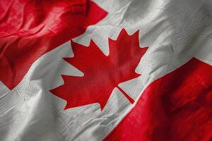 Detailed macro shot of the canadian flag waving with visible fabric texture photo