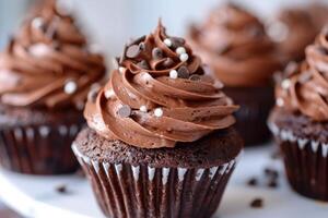 Chocolate cupcakes with whipped frosting photo
