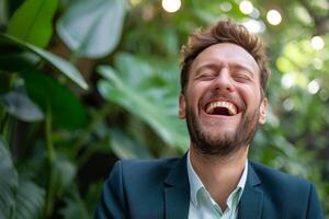 Close-up of a happy bearded man in a suit laughing with a nature background photo
