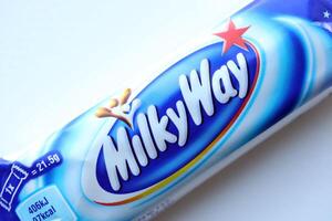 KYIV, UKRAINE - APRIL 20, 2024 Milky Way or MilkyWay small chocolate bar. Milky Way bars is worldwide famous product photo