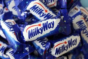 KYIV, UKRAINE - APRIL 20, 2024 Milky Way or MilkyWay small chocolate bars. Milky Way bars is worldwide famous product photo