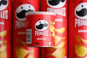 KYIV, UKRAINE - FEBRUARY 27, 2024 Pringles original potato chips on white background photo