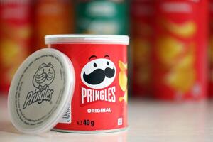 KYIV, UKRAINE - FEBRUARY 27, 2024 Pringles original potato chips on white background photo