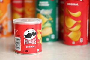 KYIV, UKRAINE - FEBRUARY 27, 2024 Pringles original potato chips on white background photo