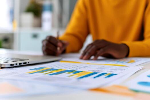 female accountant's hands at desk using chart for financial reporting in office business finance concept. photo