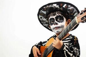 a boy playing guitar who Dressed as Mariachi Musician Entertaining with Lively Music. Day of the dead concept. photo